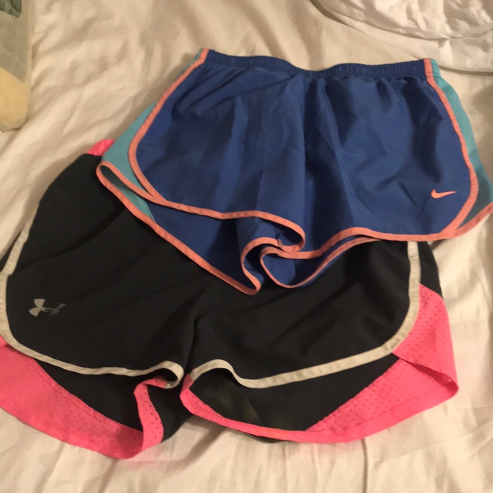 Two pairs of Nike and under amour athletic shorts